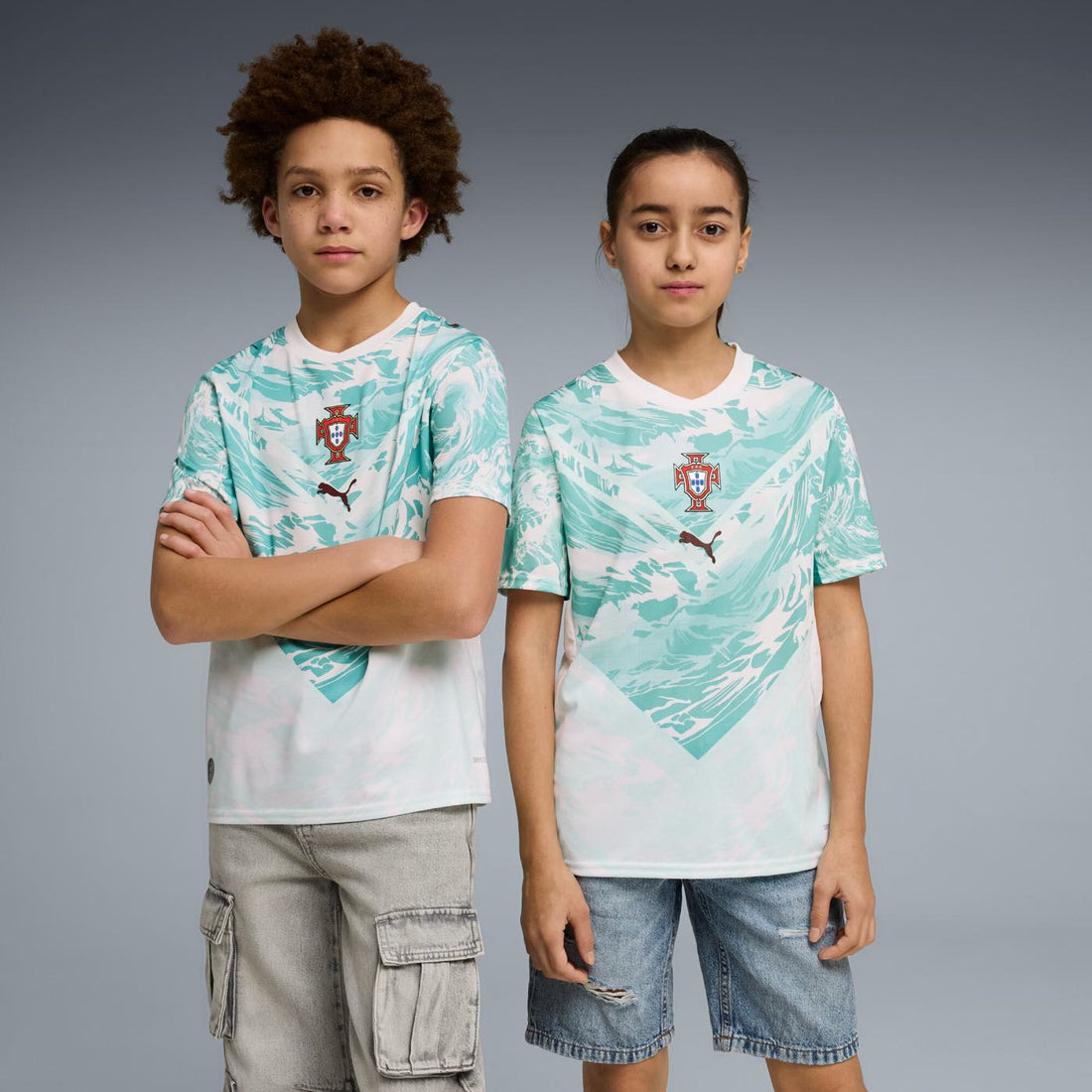 Portugal 2026 Away Jersey Youth front view worn by young model in white and lagoon green