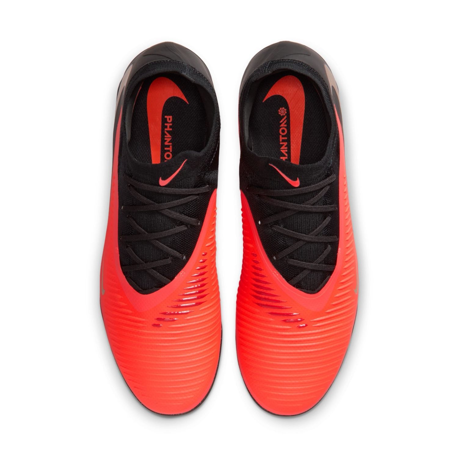 Nike Phantom 6 Low Pro TF red and black turf soccer shoes with VNMSkin upper and rubber outsole.