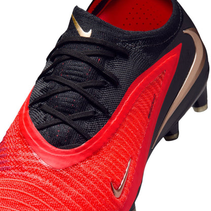 Nike Phantom 6 Low Elite AG red and black artificial-grass soccer cleats with Gripknit upper.