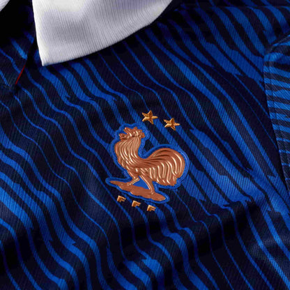 France 2026 Stadium Home Jersey Women crest close-up on blue fabric