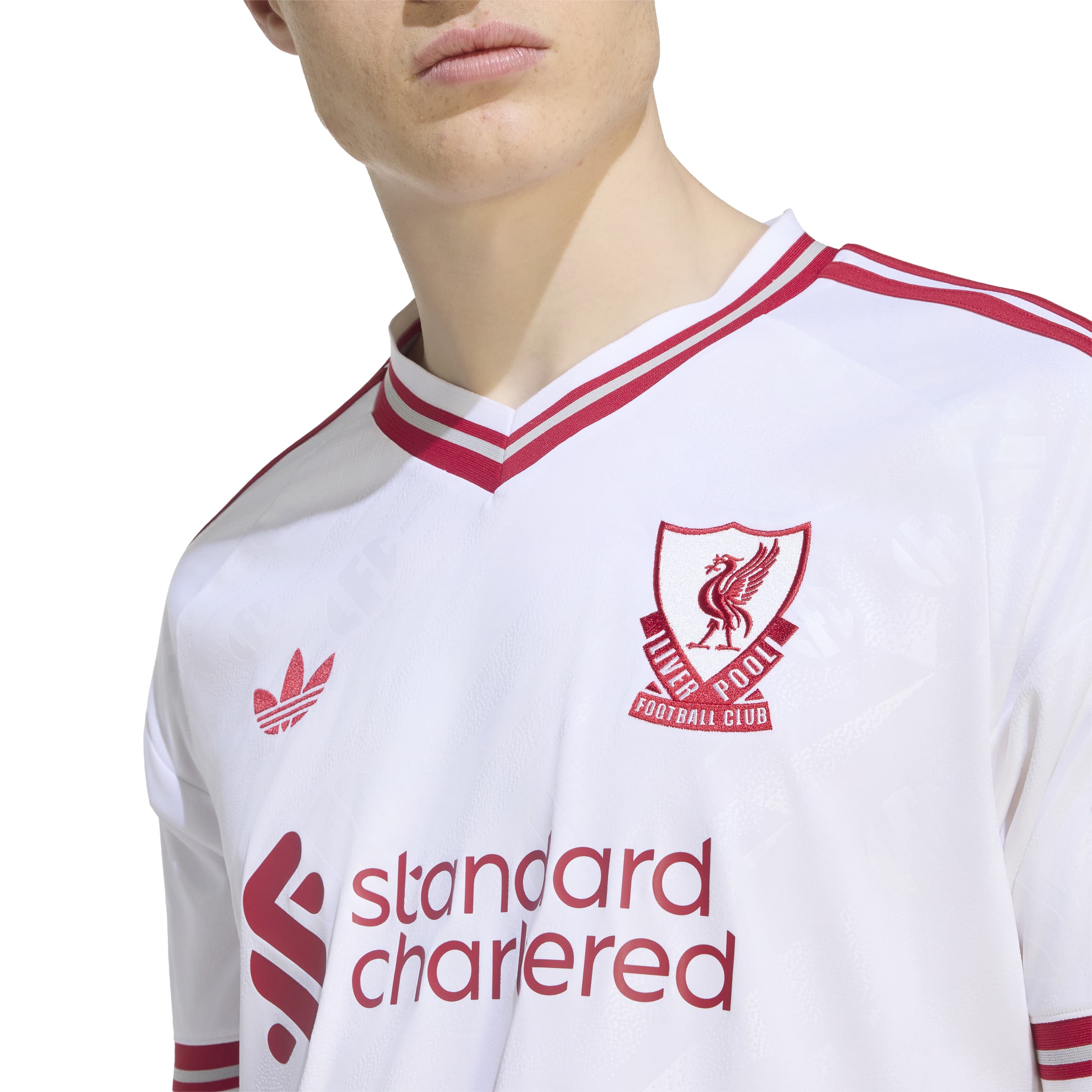 Liverpool FC 26/27 Away Jersey in white with red details, V-neck, club crest and adidas CLIMACOOL technology
