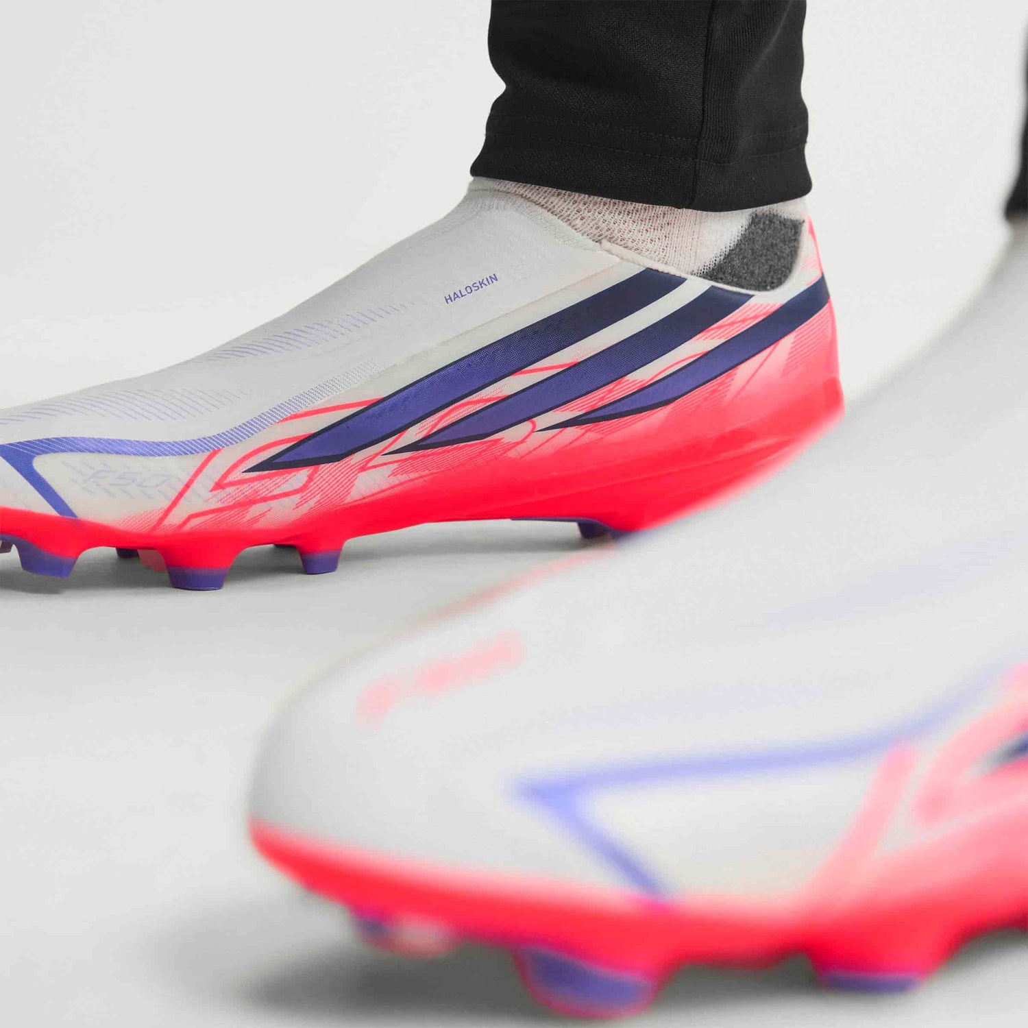 adidas F50 Hyperfast League Laceless FG soccer cleats in silver, navy and pink with firm-ground outsole