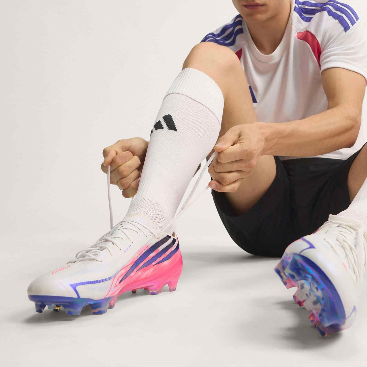 adidas F50 Hyperfast Elite FG soccer cleat in silver, navy and pink with firm-ground outsole