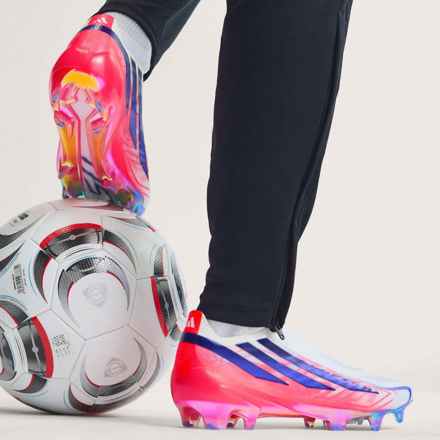 adidas F50 Hyperfast Elite Laceless FG soccer cleats in pink, white and navy with laceless HALOSKIN+ upper